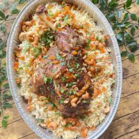Roasted juicy lamb shoulder with rice